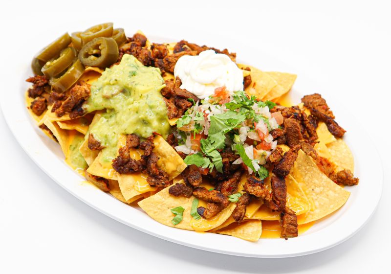 Super Nachos at La Carreta smothered with your choice of meat, pico, sour cream and guacamole