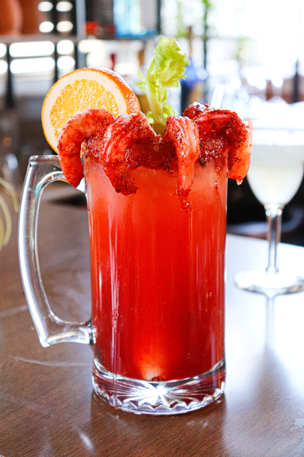 Camarones Michelada served with an orange slice and celery and your choice of beer at La Carreta.