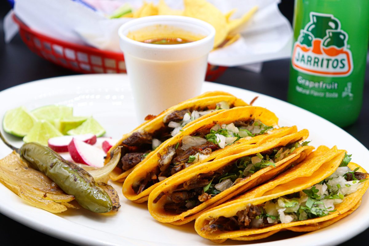 Quesabirria tacos served with consome, jalapenos and onions with radish at La Carreta.